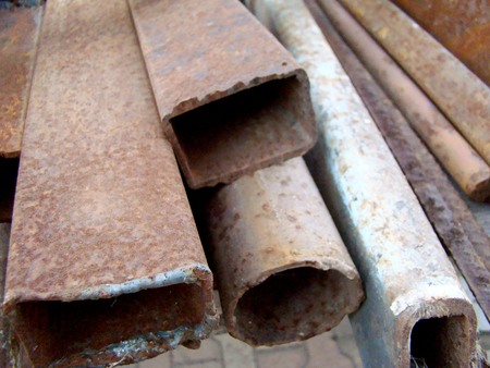 heap of scrap metal covered with rust,and steel debris.