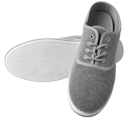 Grey sneakers isolated on white backgroundの写真素材