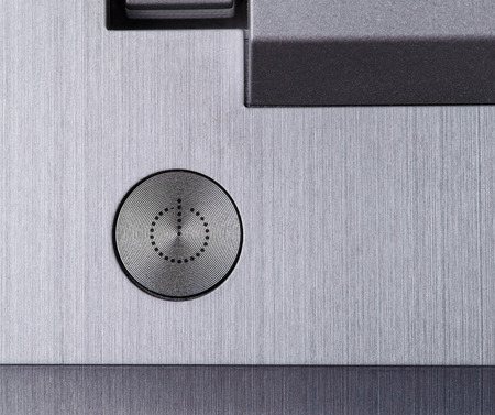The laptopâ€™s silver power off button