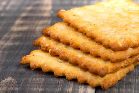 Macro shot of crackers with salt lying in a stack one on oneの写真素材