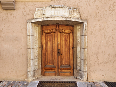 Old wooden door in the center of the old town in Riga, Latviaの写真素材