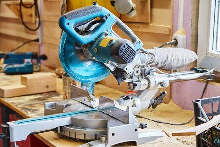 Circular saw (miter saw) photographed in the workshop atmosphereの写真素材