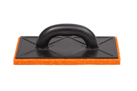 Plastic trowel with porous rubber hydro sponge isolated on white backgroundの写真素材