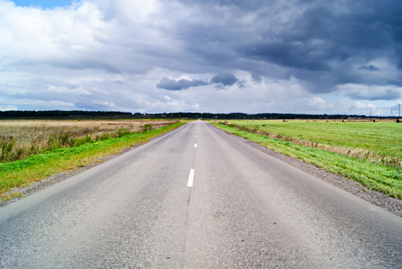 Road through the landscape. travel through scenic locations. The concept of the road.avtomobilnye travel adventures.の写真素材