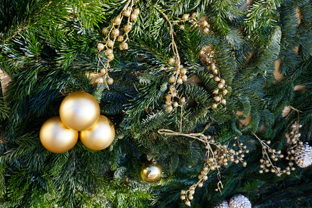Christmas or New Year backgrounds, textures. Decorated Christmas and New Year trees, tinsel, toys on a green backgroundの写真素材