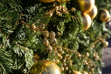 Christmas or New Year backgrounds, textures. Decorated Christmas and New Year trees, tinsel, toys on a green backgroundの写真素材