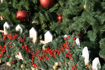 Christmas or New Year backgrounds, textures. Decorated Christmas and New Year trees, tinsel, toys on a green backgroundの写真素材