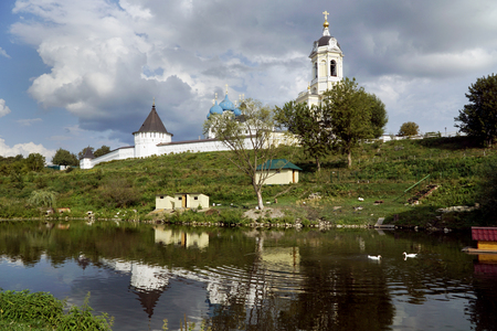 Landscape in summer, a lake with birds and a monastery. Historical sights and architecture of Russiaの写真素材