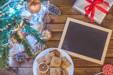 Christmas tree, toys and gifts with a clean slate for text top viewの写真素材