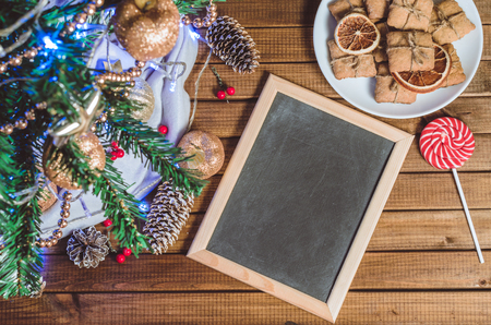 Christmas tree, toys and gifts with a clean slate for text top viewの写真素材