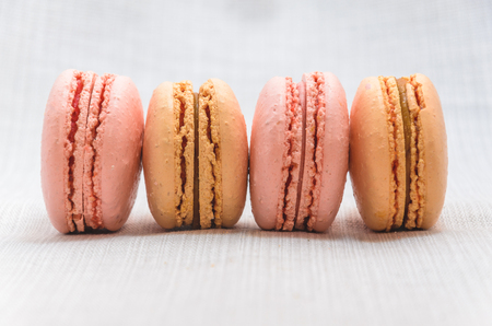 Delicious cake macaroons on light background, close upの写真素材
