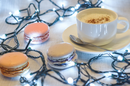 Macaroon cake and Christmas garland, close upの写真素材
