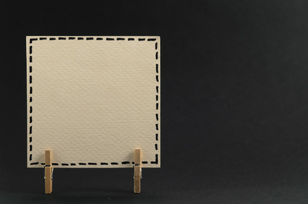 The sticker on the clothespin on black backgroundの写真素材