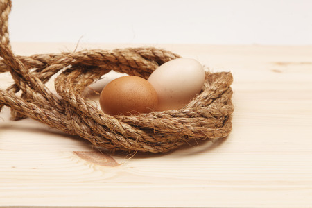 Fresh Egg With rope Harvest on Wood Table Backgroundの写真素材