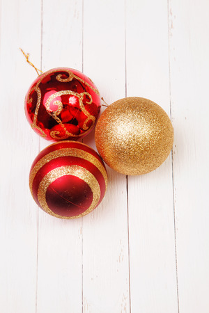 Christmass balls on white wooden backgroundの写真素材