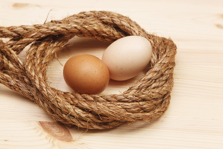 Fresh Egg With rope Harvest on Wood Table Backgroundの写真素材