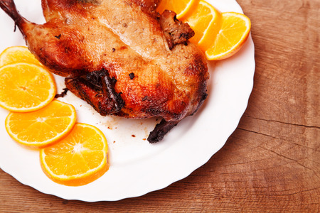 Roast duck with orangesの写真素材