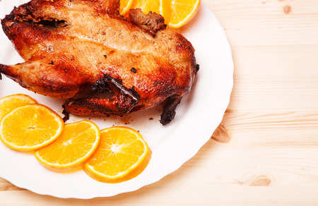 Roast duck with orangesの写真素材