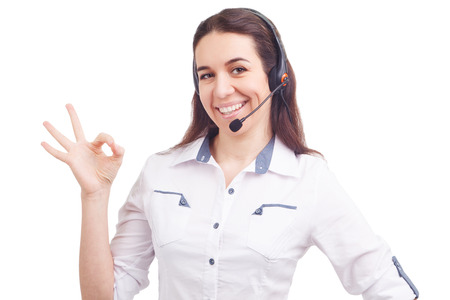 Portrait of happy smiling cheerful young support phone operatorの写真素材