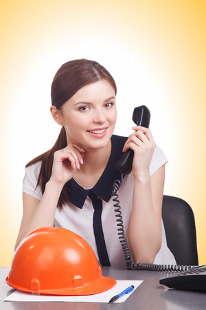 Smart young business woman with hard helmetの写真素材