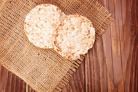 Round rice cakes on wooden tableの写真素材