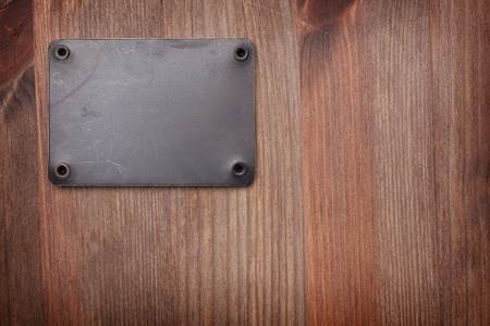 A Wooden background with metal labelの写真素材