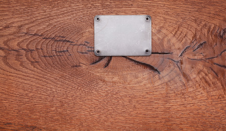 A Wooden background with metal labelの写真素材