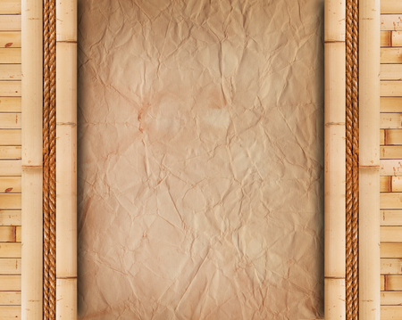 Old paper with bamboo frameの写真素材