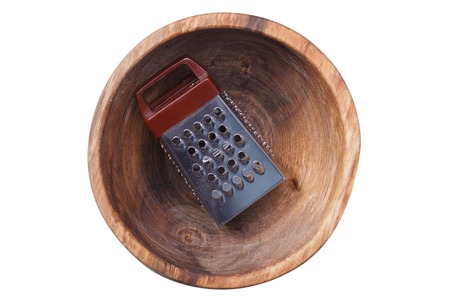 Grater lies in a wooden plate