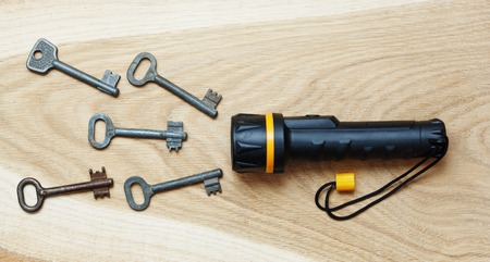 Concept, flashlight shining rays of the keysの写真素材