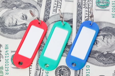 Collection of a colourful key fobs with dollars bills