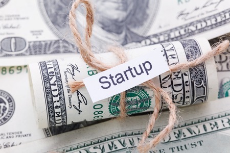 Money and business idea, The dollar tied with a rope, with a sign - Startupの写真素材