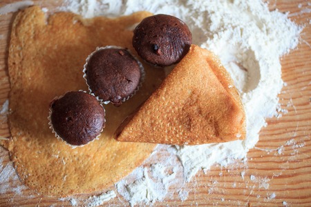 Pancakes and flour on the tableの写真素材