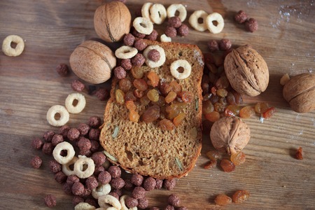 Concept of healthy food, bread, cereal raisins and whole walnutsの写真素材