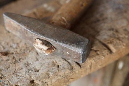 Hammer on the crafting table. The concept workplace of carpenterの写真素材