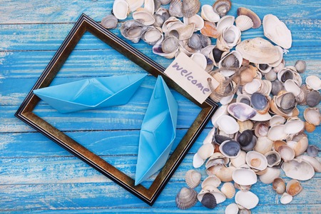 Paper Boat with shells and photo frameの写真素材