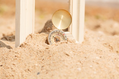 compass on sand beachの写真素材