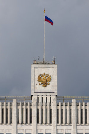 The National Flag of the Russia and a double-headed eagle â the coat of arms of Russia on the House of the Government of the Russian Federation (White House) in Moscow, Russiaのeditorial素材