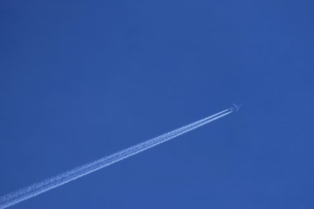 airplane in the blue sky, closeup of photo with soft focusの写真素材