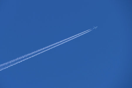 airplane in blue sky, closeup of photo with soft focusの写真素材