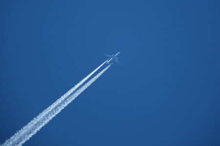 airplane in the blue sky, closeup of photo with soft focusの写真素材