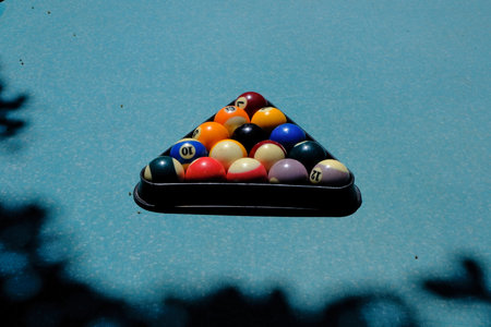Billiard balls in a triangle on a blue billiard table.の写真素材