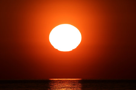 Sunset over the sea. Beautiful sunset over the sea. The sun goes down.の写真素材