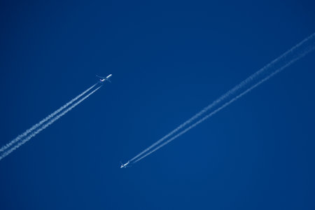 airplane in the blue sky, closeup of photo with soft focusの写真素材