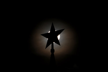 silhouette of the Kremlin star against the sunの写真素材