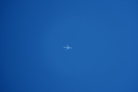 Airplane flying in the blue sky. Airplane in the blue sky.の写真素材