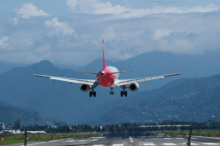 The plane lands on the airport runway. Airplane Landing at Batumi Airport, Georgia