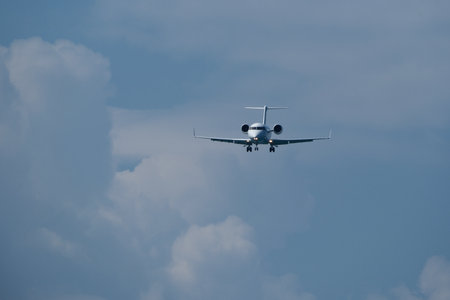Airplane in the cloudy sky.