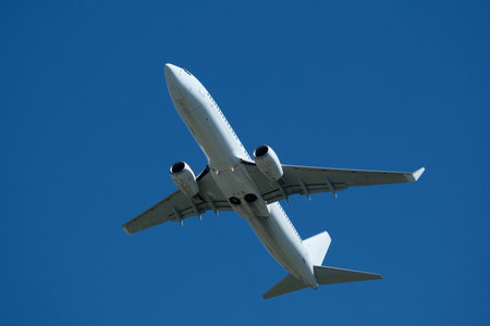 Airplane in the blue sky, close-up of the plane