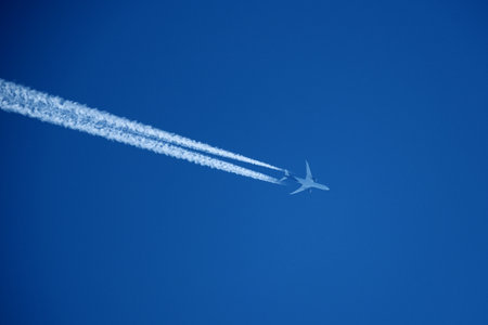 airplane in the blue sky, closeup of photo with soft focus